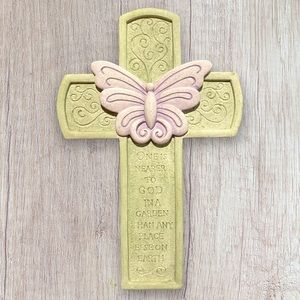 Green cross with purple butterfly. Be close to God in the garden.